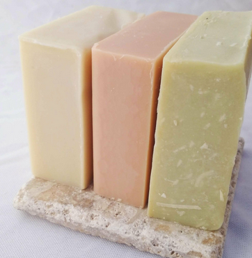 Three Blocks of Soap Atop a Soap Holder