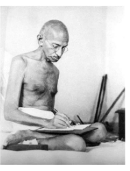 Ghandi Kneeling and Writing