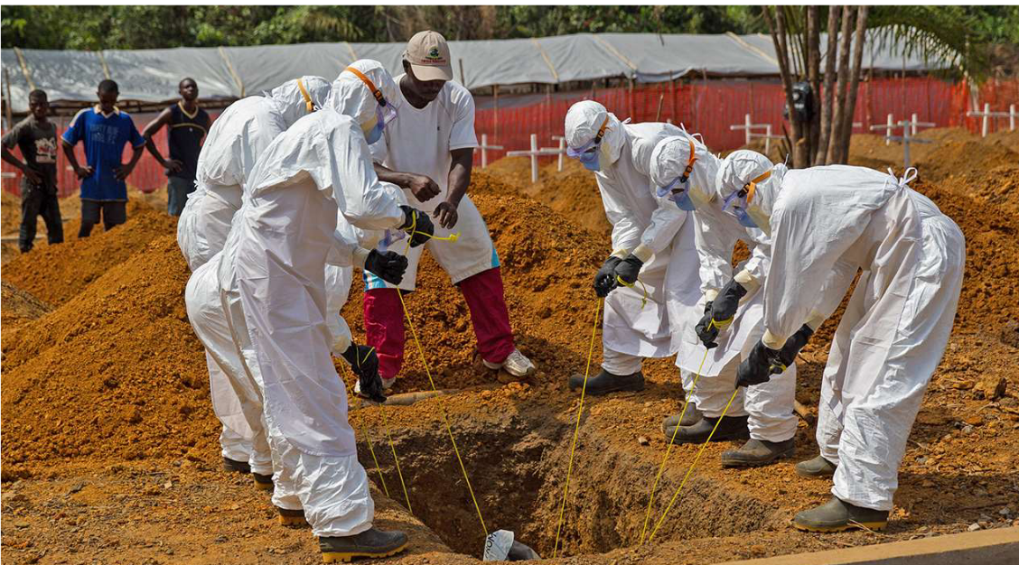 Suited Personnel Burying an Ebola Casuality