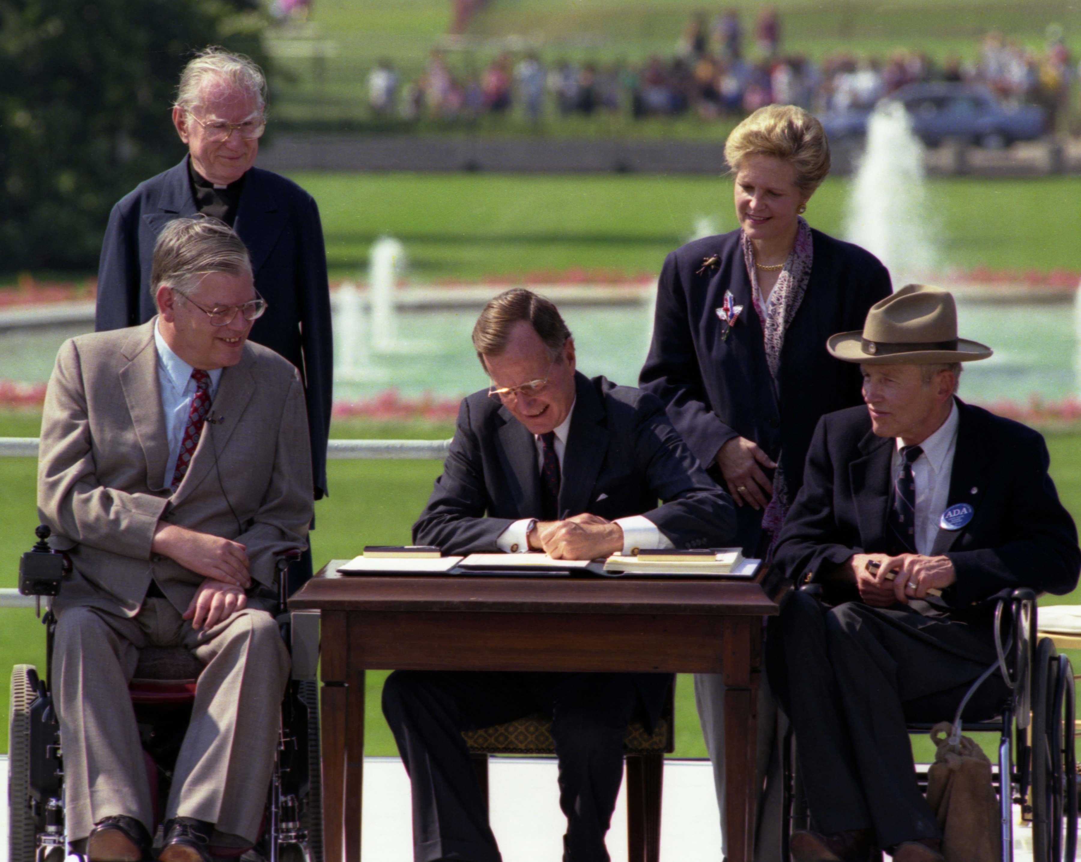 President George H. W. Bush Signs the Americans with Disabilities Act, 07/26/1990.^[[Image](https://www.flickr.com/photos/usnationalarchives/11192009475) is in the public domain]