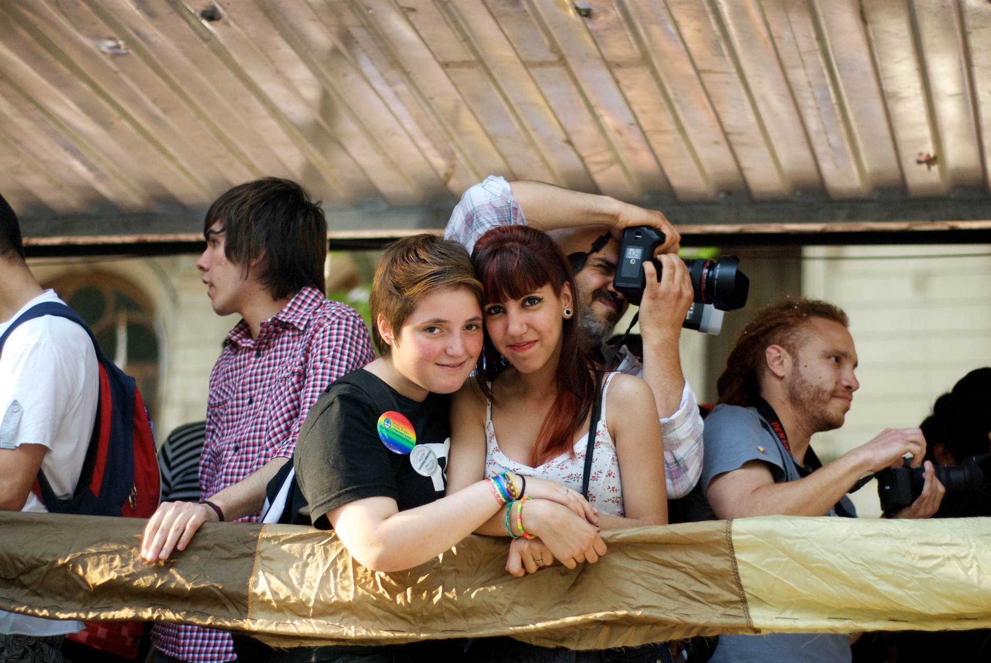 This teen couple is at a LGBTQIA pride event.^[[Image](https://www.flickr.com/photos/blmurch/6323444574/) by [Beatrice Murch](https://www.flickr.com/photos/blmurch/) is licensed under [CC BY 2.0](https://creativecommons.org/licenses/by/2.0/)]