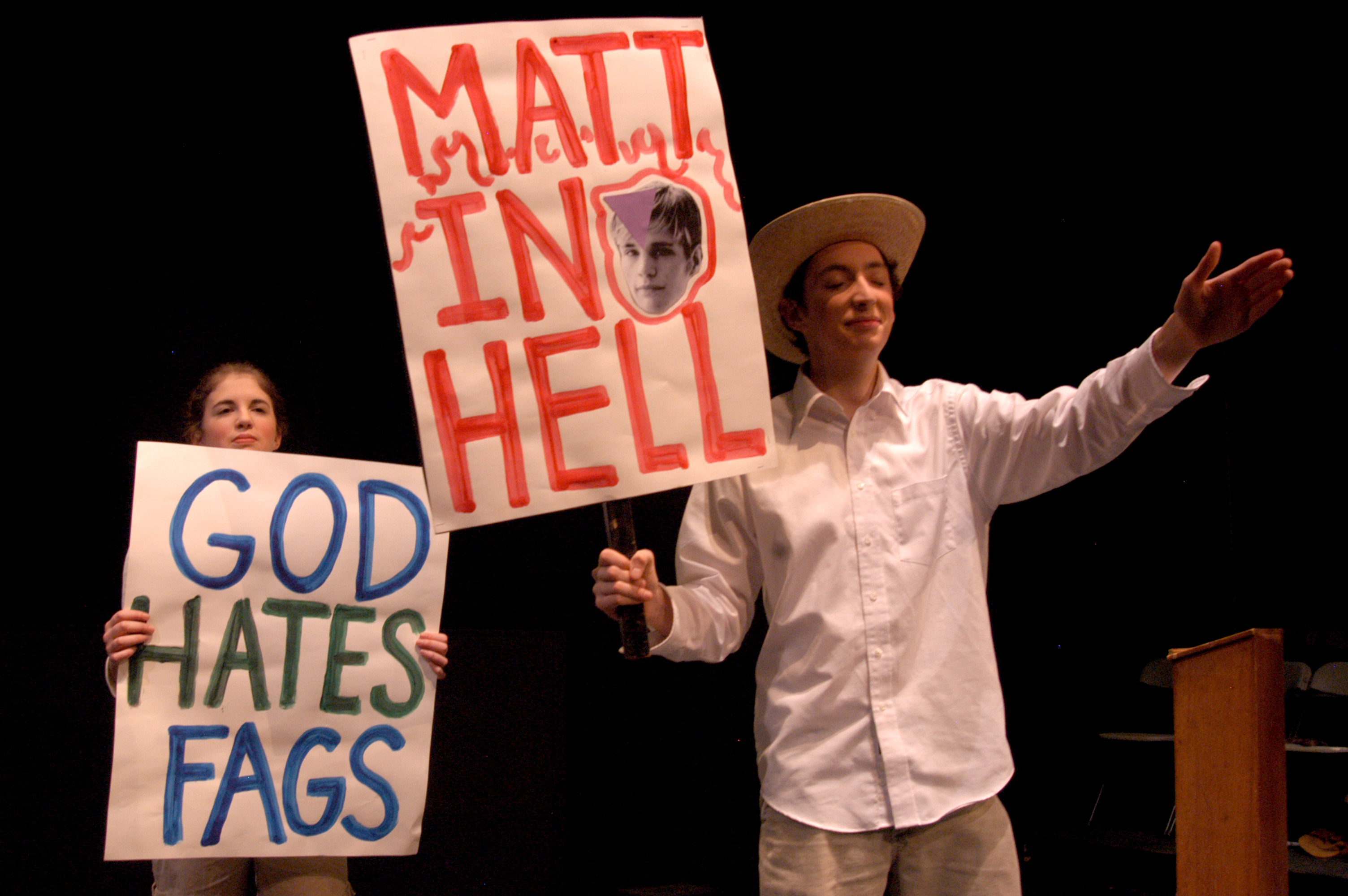 This is an example of discrimination that is portrayed in a high school play. These students from Mercer Island High School are playing Westboro Baptist Church protestors in the play The Laramie Project that tells the story of the murder of a gay college student, Matthew Shephard.^[[Image](https://www.flickr.com/photos/91281489@N00/286552276/) by [Jeff Hitchcock](https://www.flickr.com/photos/91281489@N00/286552276/) is licensed under [CC BY 2.0](https://creativecommons.org/licenses/by/2.0/)]