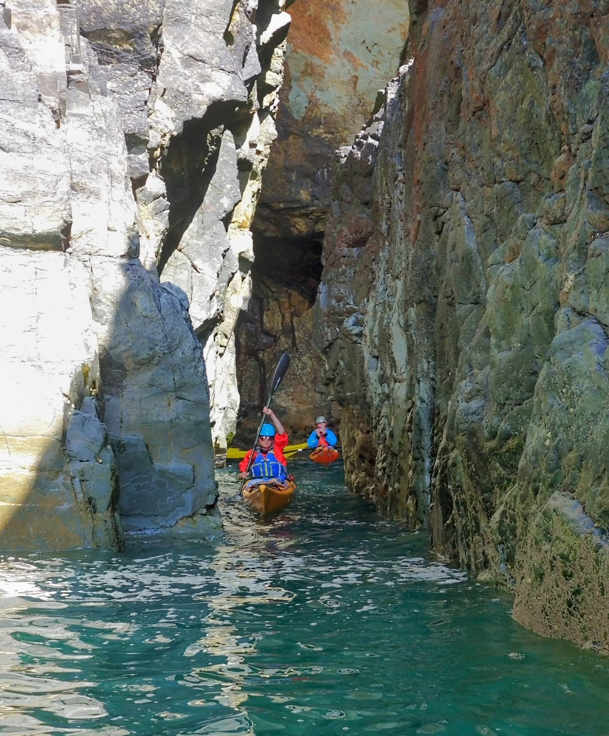 Paddling group negotiating narrow channels on the Pembrokeshire coast