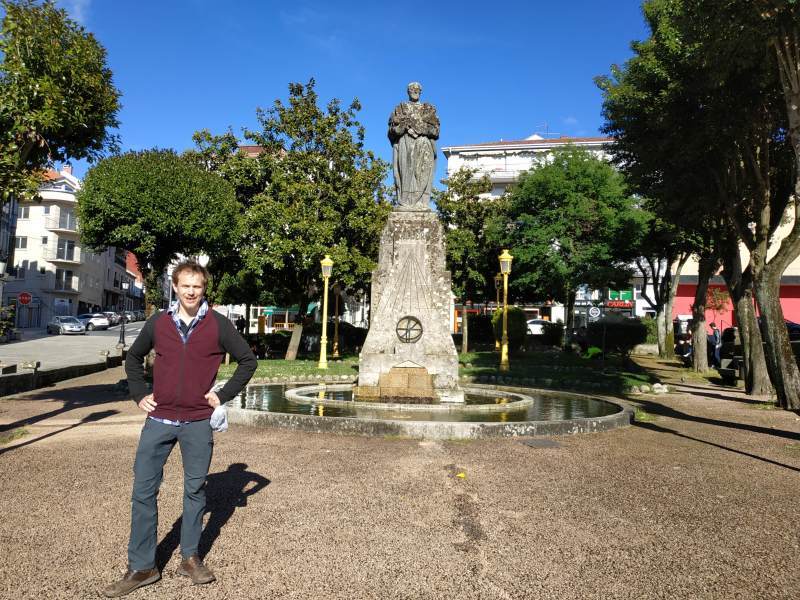 Robin proudly poses outside a statue of his new hero: the Galician Mathematician Ramon Aller.